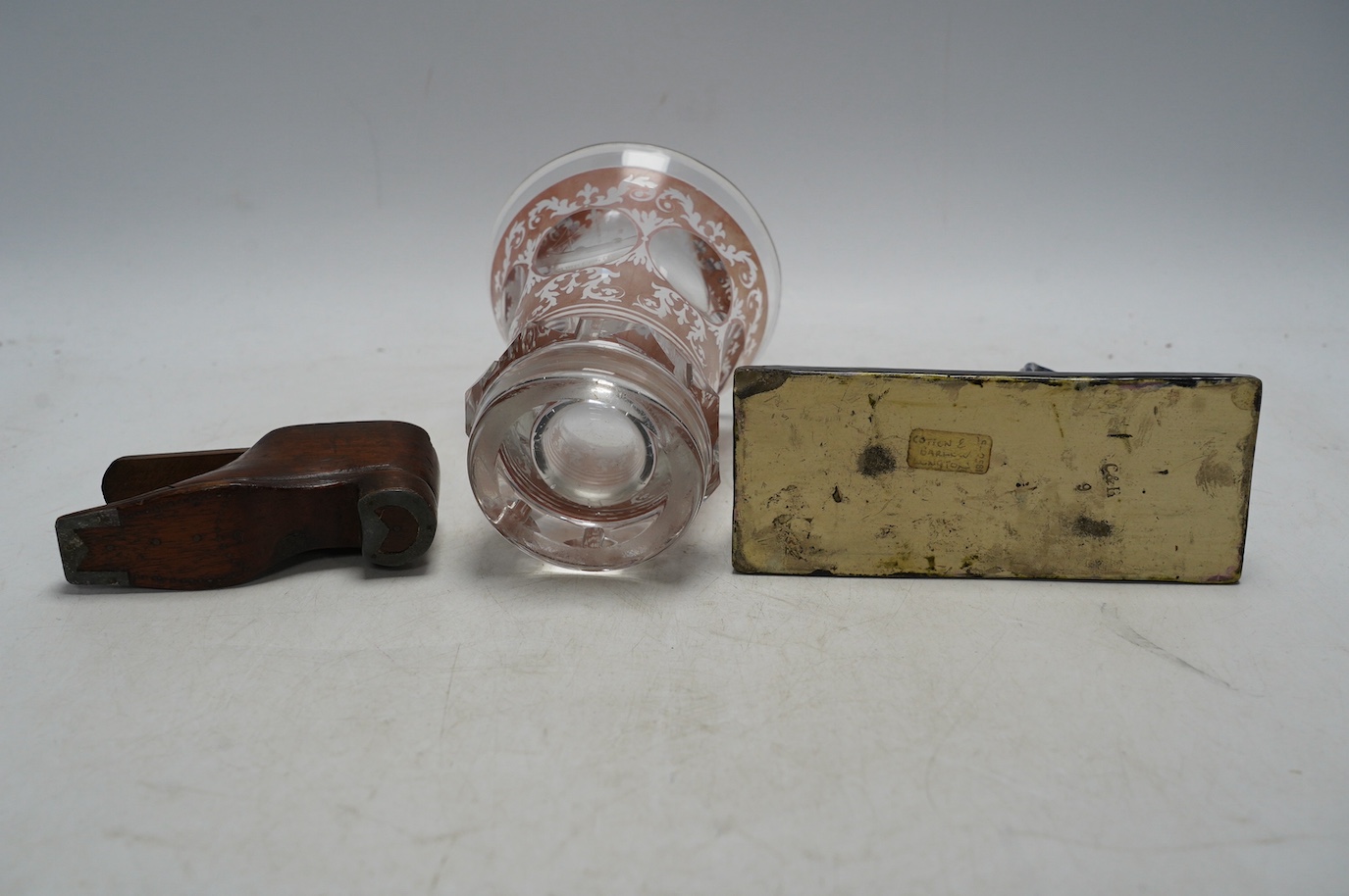 Sundry items comprising a Victorian flashed cut and engraved beaker, a 19th century model of a sphinx, and a green shoe snuff box. Condition - fair